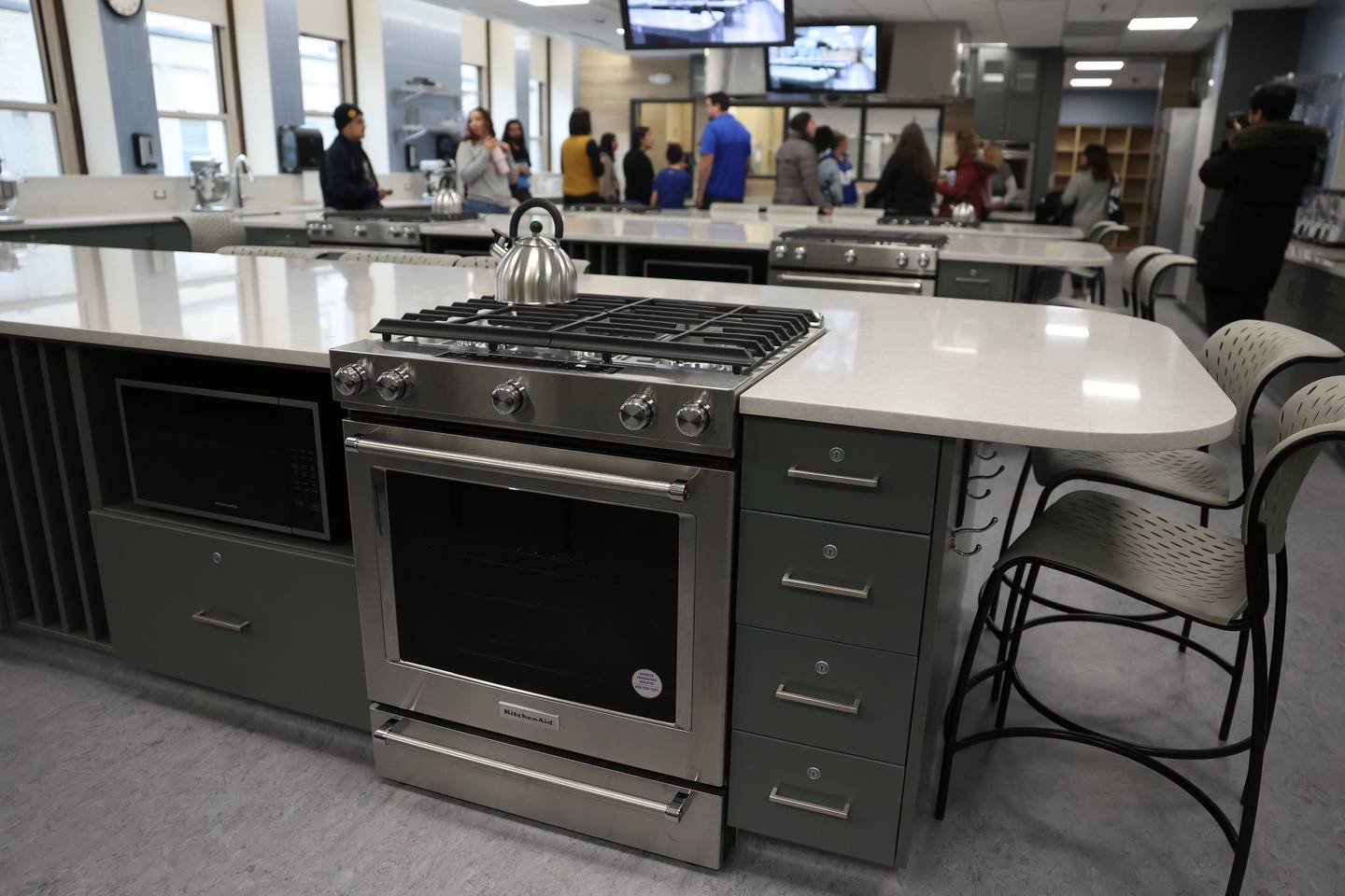 Guest tour one of the two state-of-the-art culinary labs that can accommodate 32 students at the ribbon cutting ceremony for Joliet Central’s new culinary arts addition on Monday, Jan. 6, 2025 in Joliet.