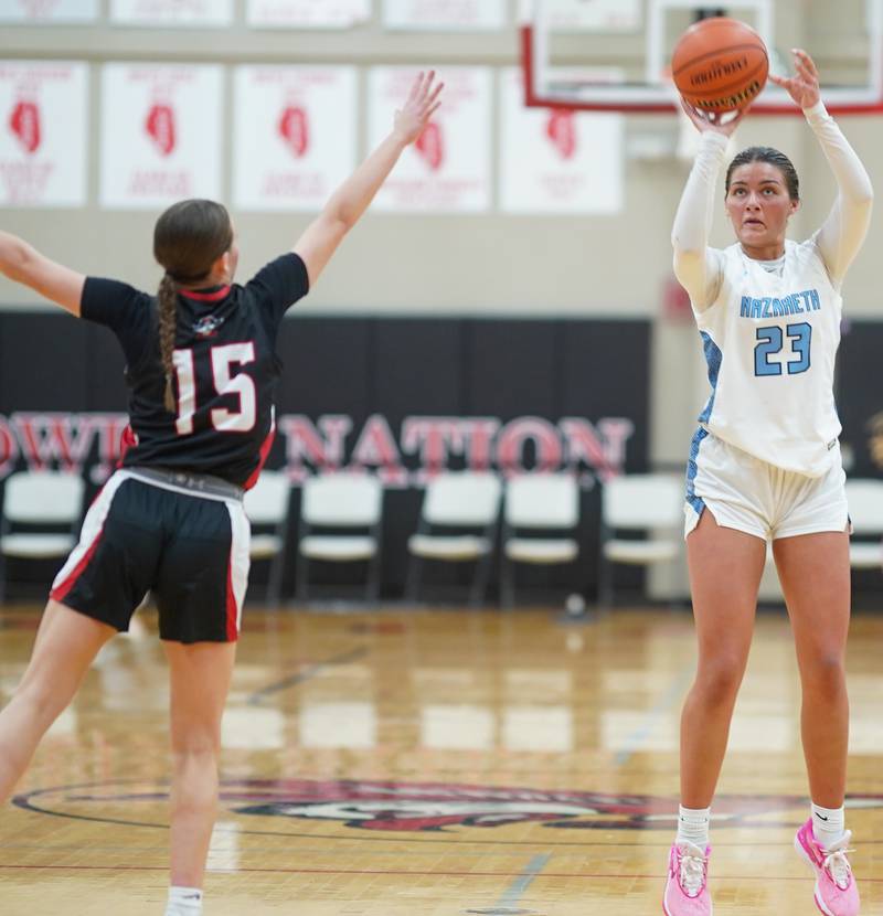 Nazareth forward Danielle Scully (23) shoots the ball at the top of the key against Pewaukee (WI) guard Kylie Pieper (15) during the 34th annual Coach Kipp’s Hoops Fest at Benet Academy in Lisle on Monday, Jan 15, 2024.