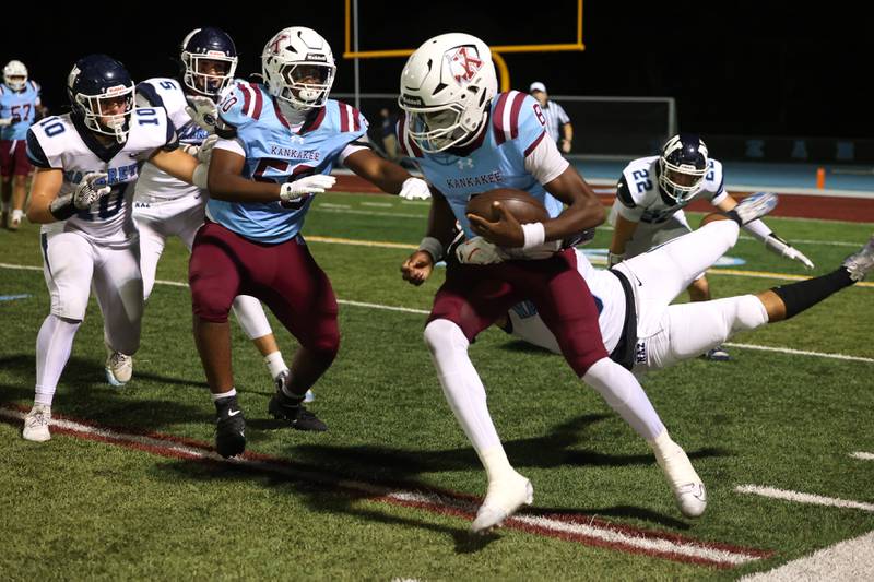 Kankakee's Kymani Billings is wrapped up by Nazareth's Noah Sanchez during Kankakee's 33-12 loss to Nazareth on Friday, Aug. 29, 2025.