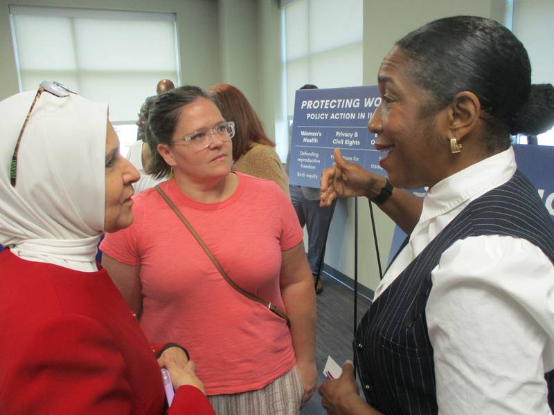 Lt. Gov. Juliana Stratton (right) meets with attendees after a panel discussion on women's health held Friday at the Will County Health Department building in Joliet. Aug. 15, 2025