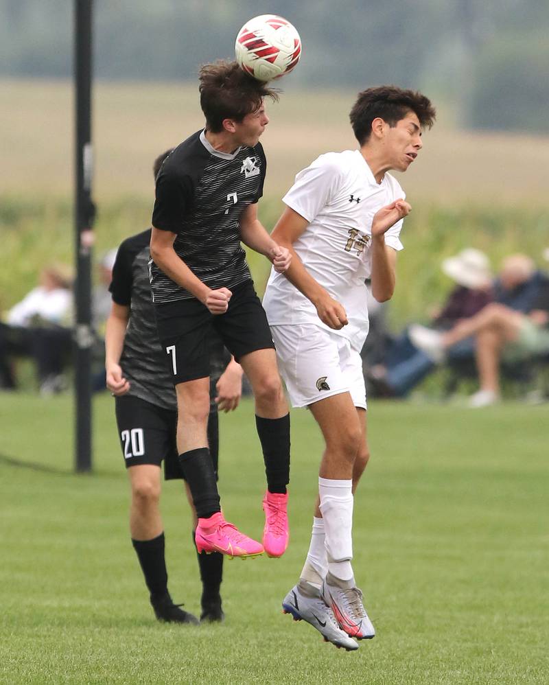 Kaneland's Cameron Guernon (left) and Sycamore's Javier Lopez go up for a header during their game Wednesday, Sept. 6, 2023, at Kaneland High School in Maple Park.