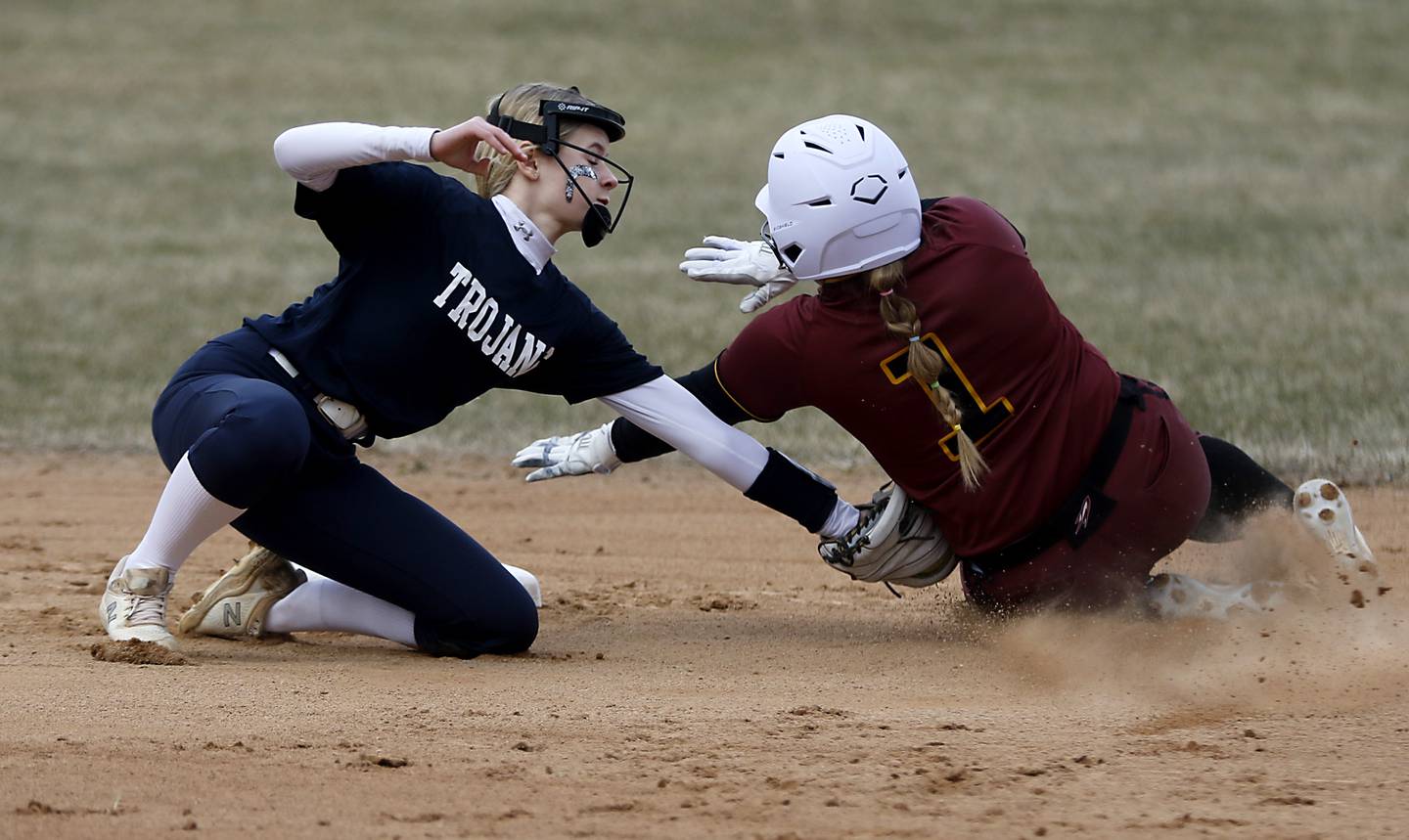 Cary-Grove’s Aubrey Lonergan tags out Richmond-Burton’s Lyndsay Regnier as she tries to steal second base during a non-conference softball game Tuesday, March 21, 2023, at Cary-Grove High School.