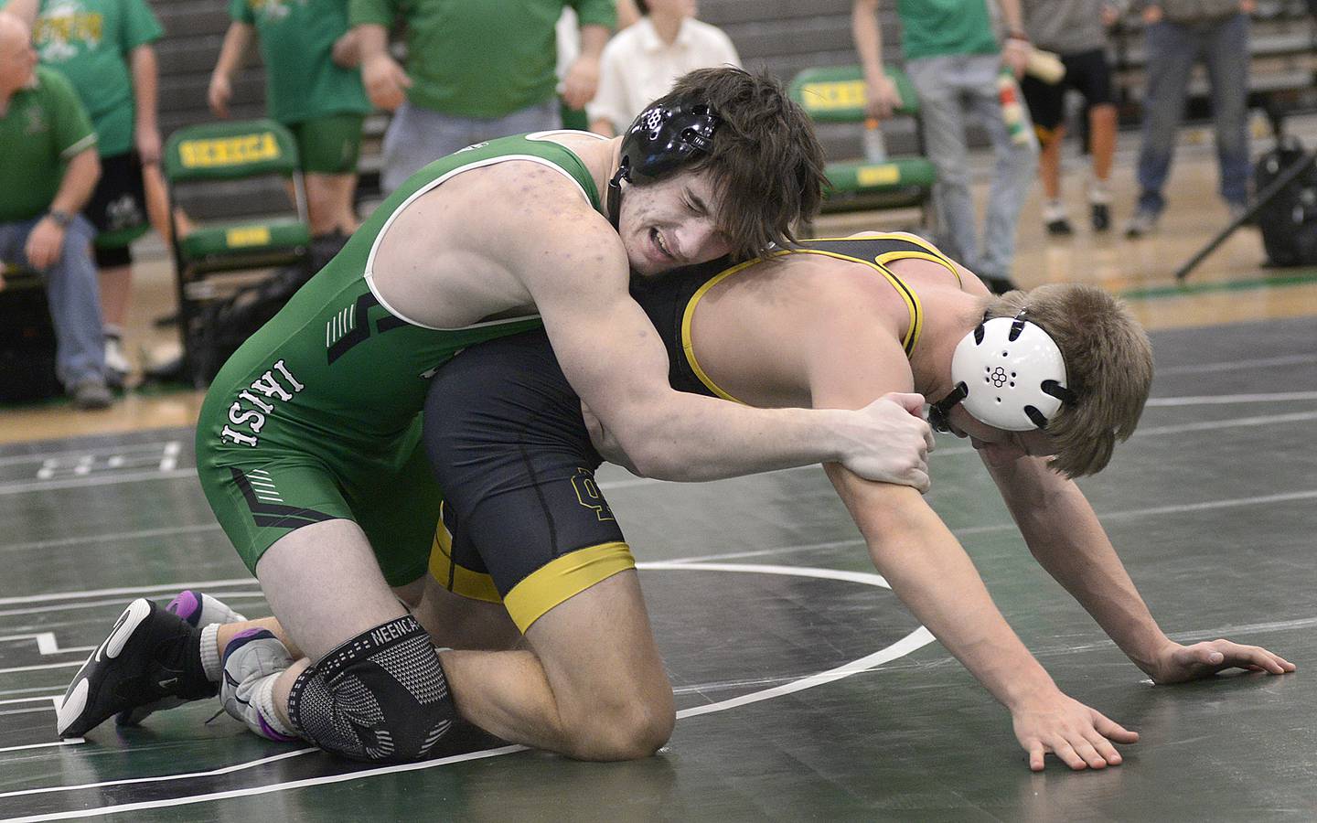 Seneca’s Avery Phillips works to bring down Reed Custer’s Nathan Kuntz in the 144 # match Wednesday at Seneca.