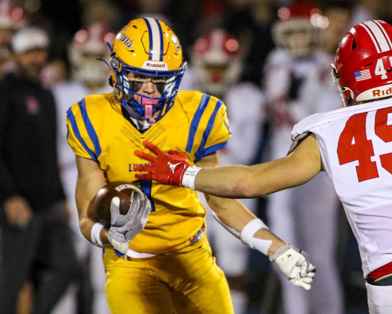 Lyon's Mack Long (1) runs after a long reception down field during Class 8A quarterfinal football game between Naperville Central at Lyons on Friday, Nov 15, 2024  in Western Springs.