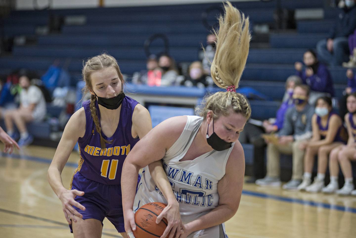 Newman's Shannon Kelly and Mendota's Natalie Bodmer wrestle for a loose ball Thursday, Jan. 27, 2022.