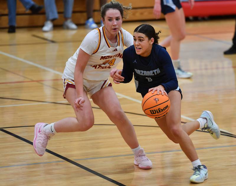 Nazareth’s Allia Von Schlegell drives as Montini’s Peyton Farrell defends during a Coach Kipp Hoopsfest game on January 20, 2025 at Benet Academy in Lisle.