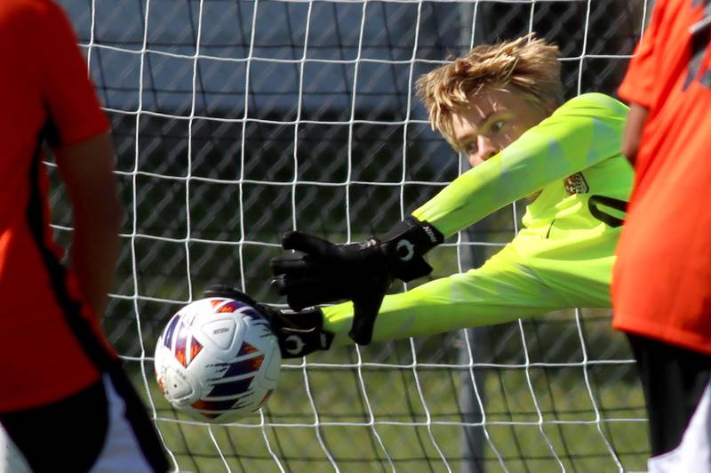 Crystal Lake Central’s goalkeeper Chase Lemke makes a diving save against Harvard in varsity boys soccer at Crystal Lake Central High School in Crystal Lake on Saturday, Sept. 6, 2025.
