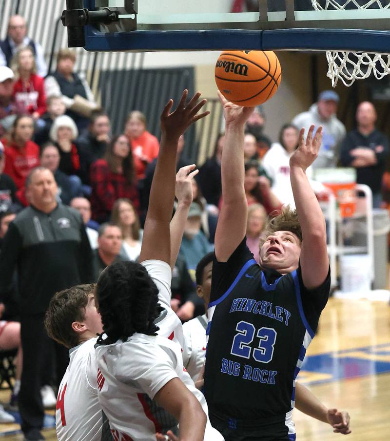 Hinckley-Big Rock's Luke Badal goes to the basket against Aurora Christian's Jordan Weeks during their sectional final game Friday, March 7, 2025, at Somonauk High School.