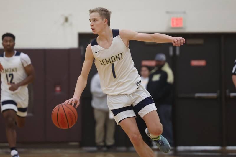 Lemont’s Matas Castillo works the ball past midcourt against Romeoville in the WJOL Thanksgiving Classic Championship in Joliet on Saturday.