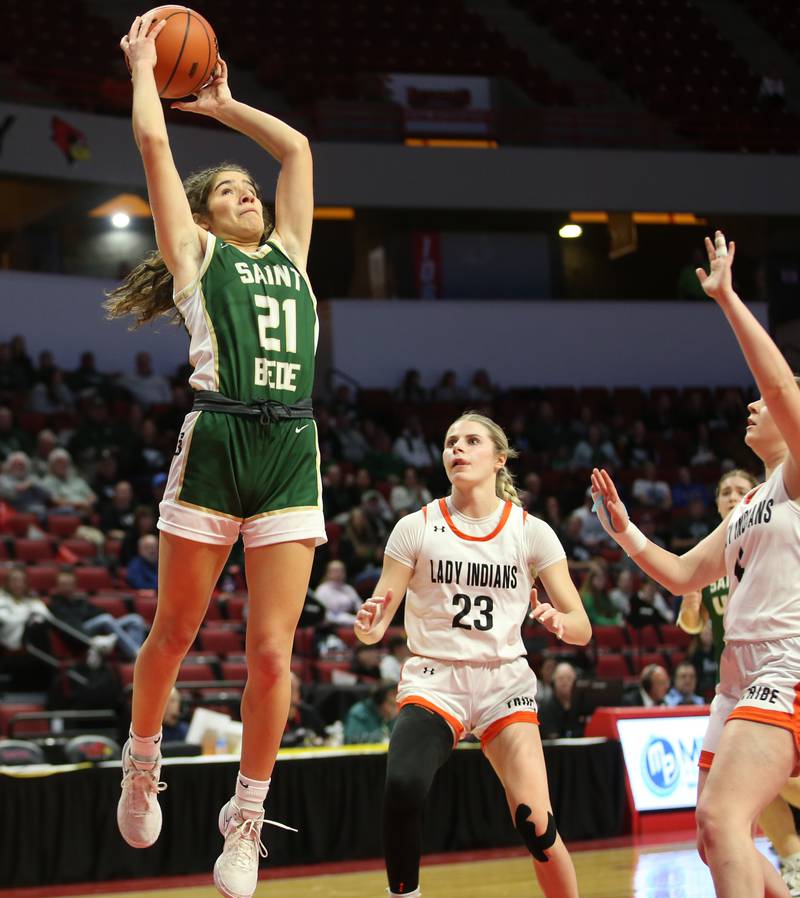 St. Bede's Lili Bisnich leaps in the air to catch a pass over Altamont's Grace Nelson and teammate Libby Reardon during the Class 1A third-place game on Thursday, Feb. 29, 2024 at CEFCU Arena in Normal.