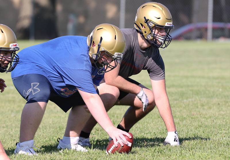 Hiawatha's Zach Edwards (right) lines up for a play Wednesday, Aug.10, 2022, during practice at the school in Kirkland.