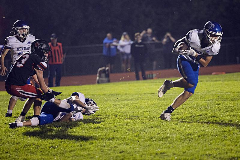 Newman’s Anderson Verhulst snags an interception on a tipped ball at the goal line against Erie-Prophetstown Friday, Sept. 22, 2023 in Erie.