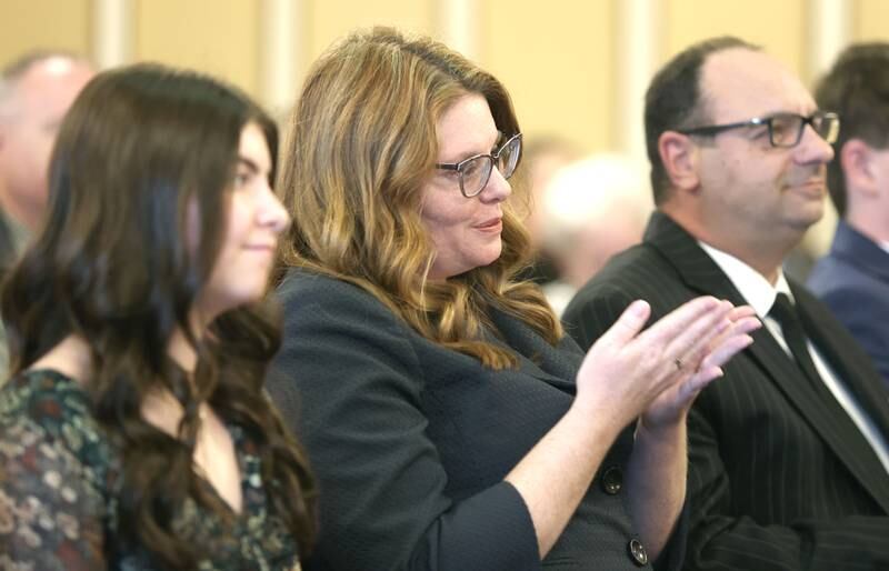 Sarah Gallagher Chami gestures to Judge Marcy Buick as Buick talks about Gallagher Chami's accomplishments as an attorney prior to being sworn in as an associate judge of the 23rd Judicial Circuit Friday May 6, 2022, at the DeKalb County Courthouse in Sycamore.