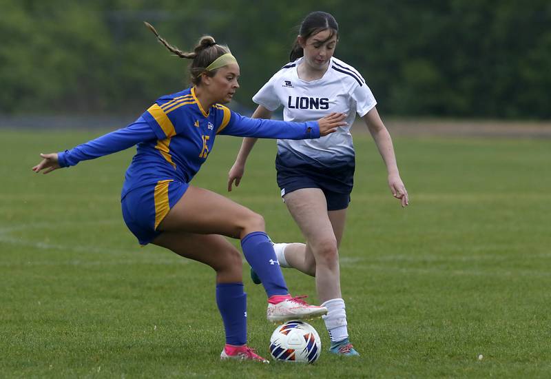 Johnsburg's Lauren McQuiston controls the ball in front of Harvest Christian Academy's Sheridan St. Lowis player during the Class 1A Marian Central Girls Soccer Regional Championship match on Tuesday, May 20, 2025, at Marian Central High School in Woodstock.