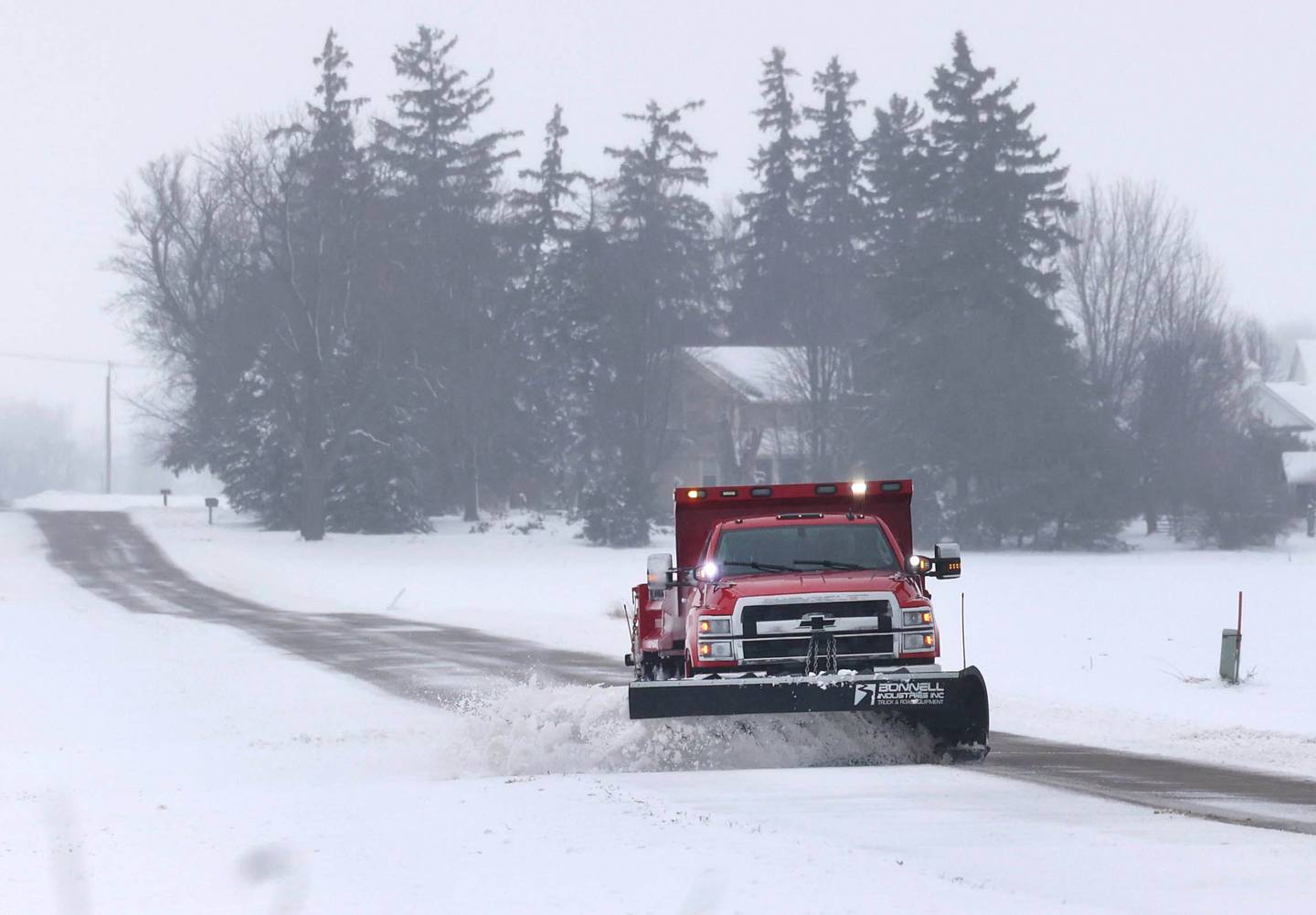 A snow plow makes its way south down Pritchard Road Friday, Jan. 12, 2024, near Hinckley. Several inches of snow blanketed DeKalb County Friday on top of the 6 inches that fell on the area earlier this week.