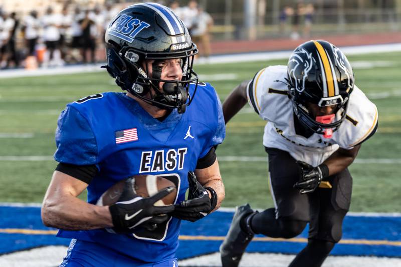 Lincoln-Way East's Matt Orban scores a touchdown during a varsity football game against Metea Valley at Lincoln-Way East on Oct. 3, 2025.