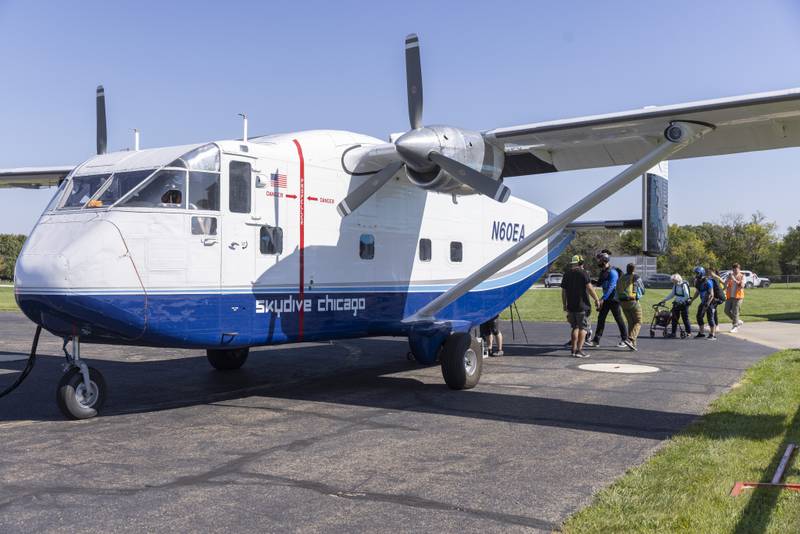 104 year old Dorothy Hoffner heads for the Skyvan aircraft that will transport her up to 13,000 feet for her world record attempt for the oldest person to skydive. The jump took place at Skydive Chicago on October 1, 2023.