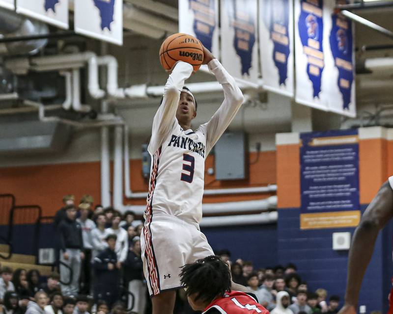 Oswego's Ethan Vahl (3) shoots a fade away jumper during their basketball game between West Aurora at Oswego Monday, Nov 24, 2025 in Oswego.
