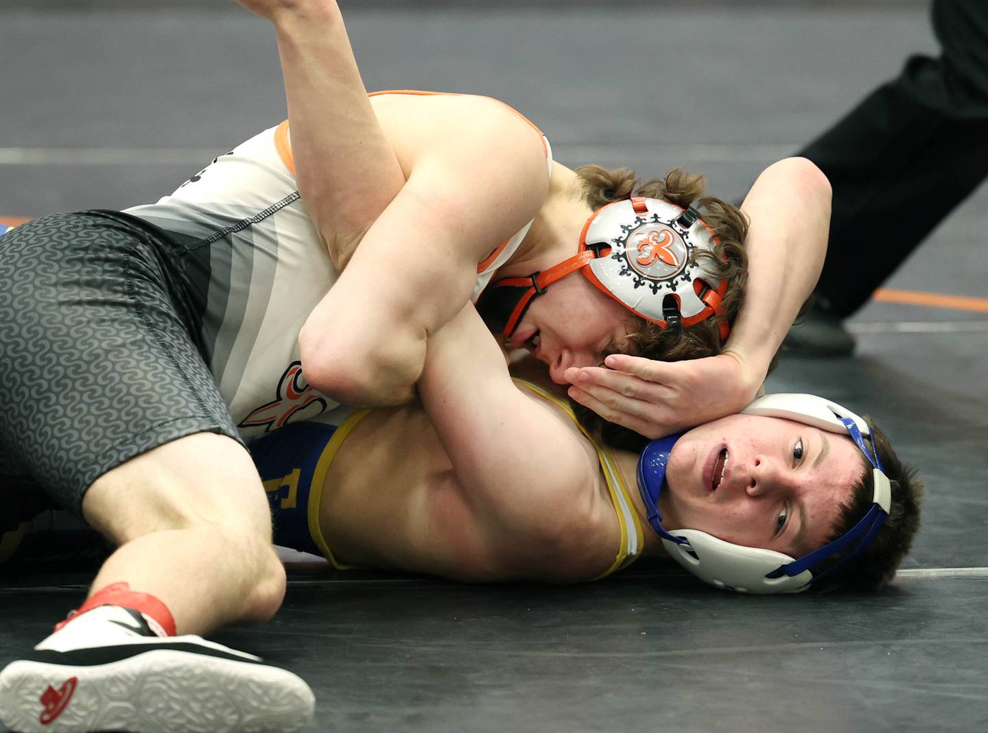 St. Charles East’s Ben Davino works to pin David Hyde of Wheaton North during their 132 pound championship match Saturday, Feb. 3, 2024 in the Class 3A regional at DeKalb High School. Davino won the match with a fall.