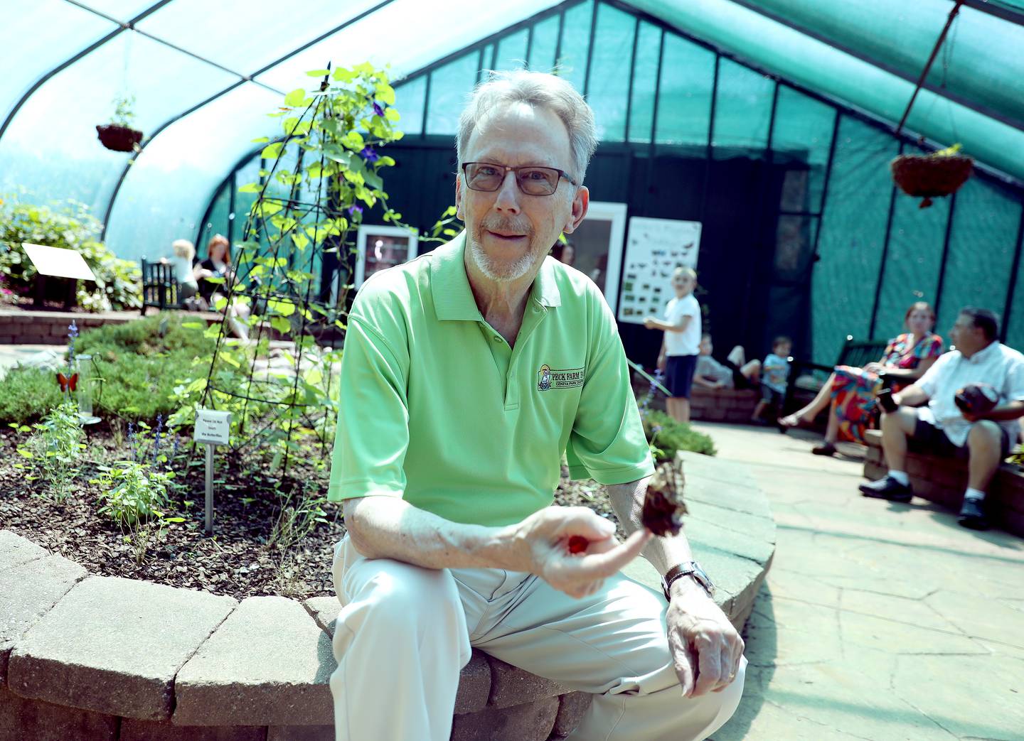 Air Force Veteran Larry Cabeen serves as the Geneva School District 304 board president as well as a volunteer at teh Peck Farm Park Butterfly House.