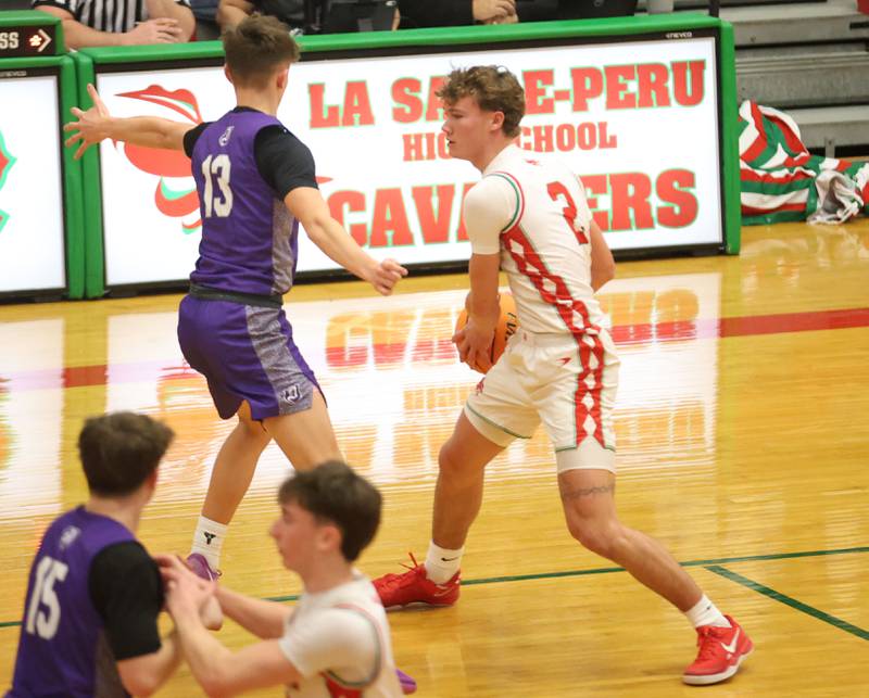 L-P's Regan Doerr looks to pass the ball around Dixon's Beckham Rock on Tuesday, Jan. 20, 2026 in Sellett Gymnasium at L-P High School.
