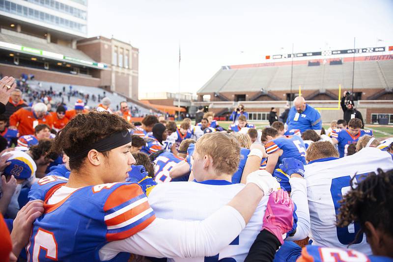 In what may go down as a classic contest, St. Teresa Decatur and Tri-Valley Downs come together in prayer after a hard fought game. St. Teresa took the game 29-22 in the class 2A IHSA football state championship game Friday, Nov. 25, 2022.