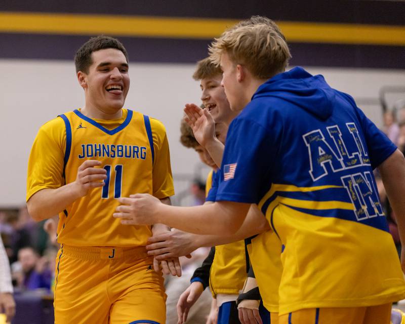 Ryan Franze is welcomed back to the bench with excitement after helping the team extend their fourth quarter lead against Rockford Lutheran during the IHSA 2A Sectional Championship game on March 6, 2026 at Mendota High School.