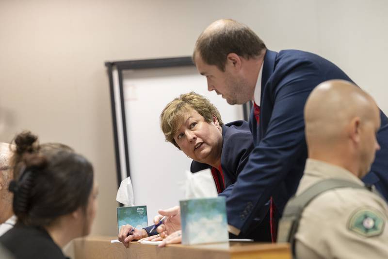 Whiteside County State's Attorney Colleen Buckwalter and Whiteside County Assistant State's Attorney Ryan Simon speak to the Gordon family Thursday, May 22, 2025, in Whiteside County Circuit Court in Morrison.
