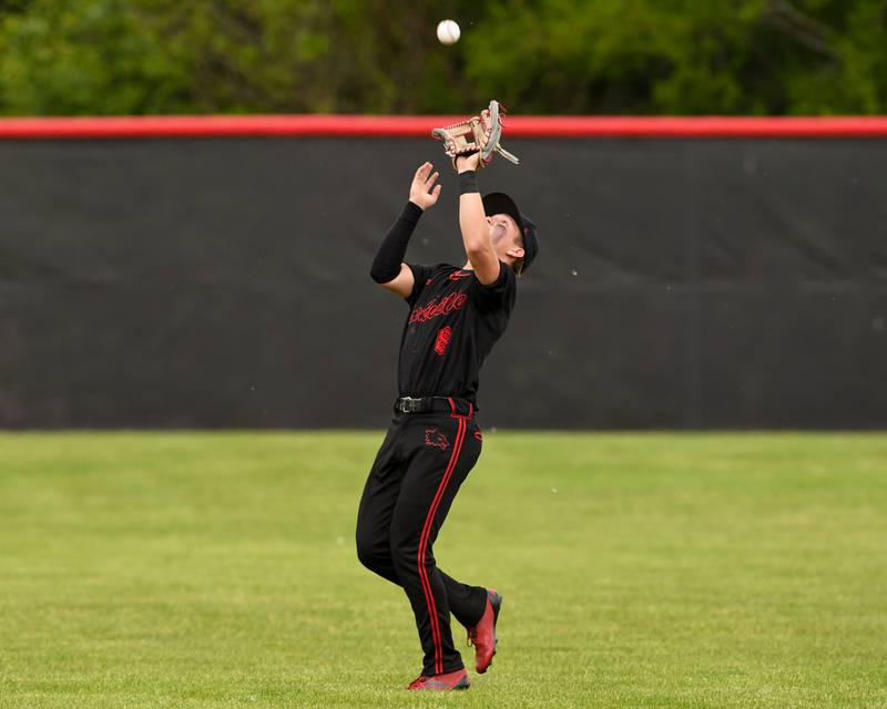 Yorkville's Justin Giese(8) catches the ball for an out while taking on Romeoville during the regional game held at Yorkville High School.