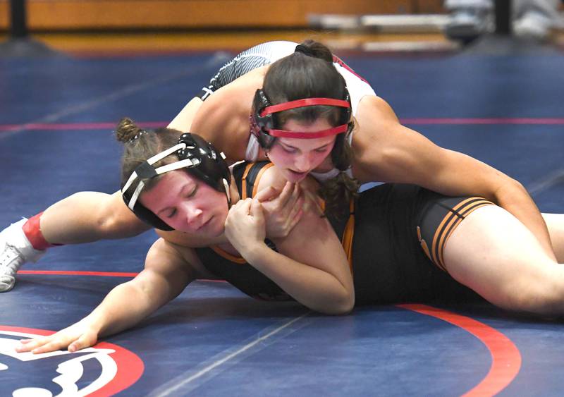 Fulton's Kerby Germann holds Harlem's Madison Heneks to finish first at 130 pounds during the Belvidere Regional on Saturday, Feb. 7, 2026.
