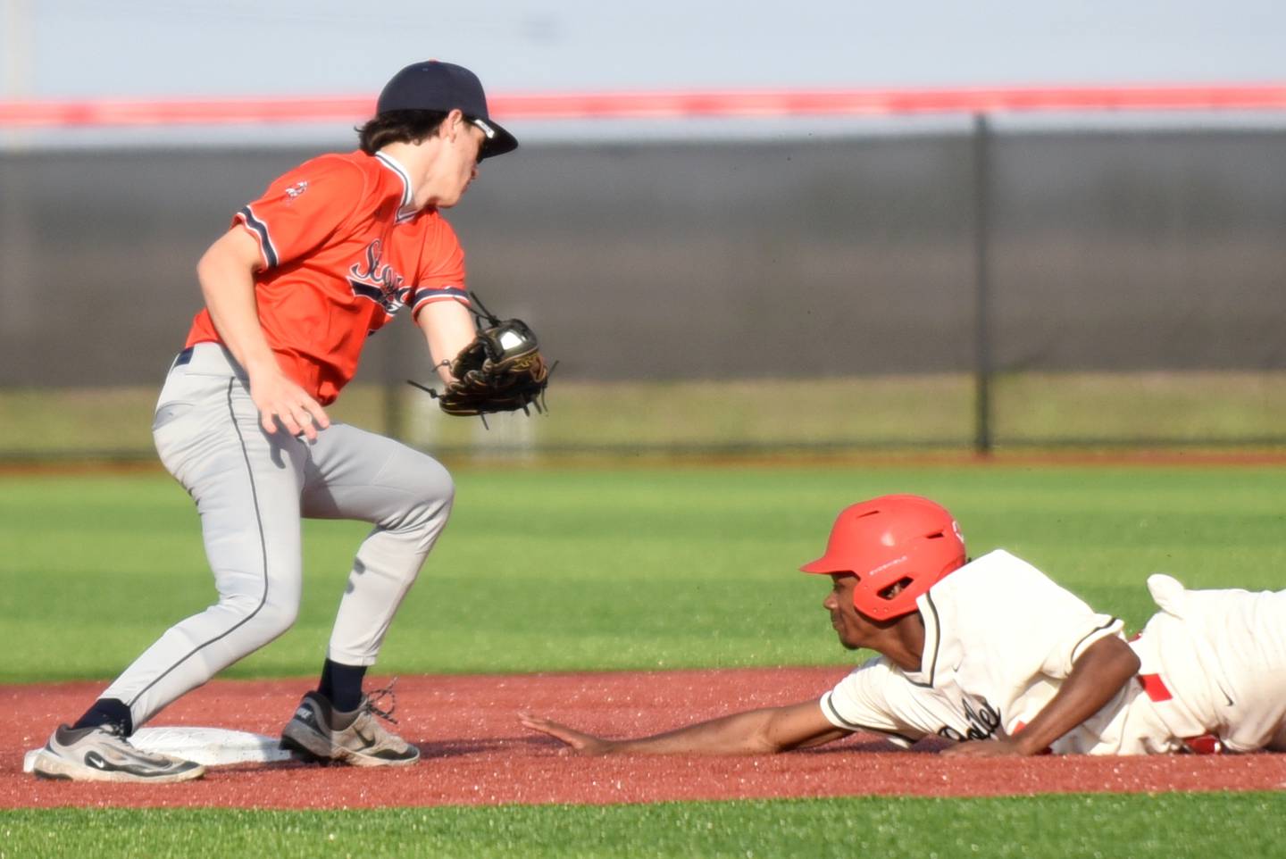 Bradley-Bourbonnais' Byron Summral, right, dives into second base ahead of a tag from Stagg's Ricky Rivas during a game at Bradley-Bourbonnais Friday, May 8, 2026.
