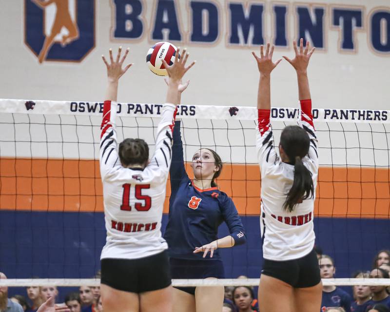 Oswego's Sara Gilio (8) spikes the ball during volleyball match between Yorkville at Oswego. Sept 23, 2025.