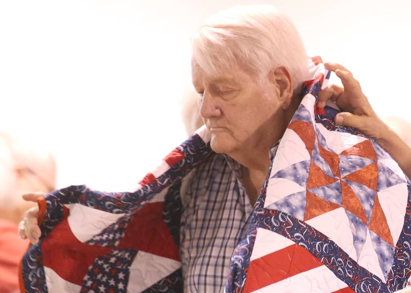U.S. Navy Veteran Frederick West, of Princeton, receives his Quilt of Valor during the Tribute to Veterans on Wednesday, Aug. 20, 2025 at the Bureau County Fair in Princeton.