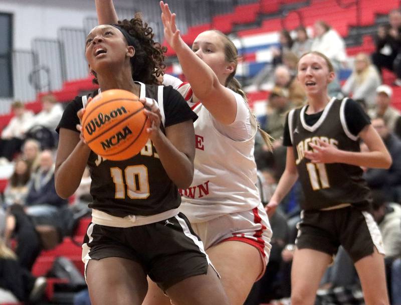 Jacobs’ Zara Lewis works under the hoop in varsity girls basketball on Friday, Dec. 12, 2025, at Dundee-Crown High School in Carpentersville.