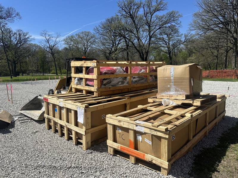 Equipment rests in palletts on the ground for Logan's Oasis playground on  Monday, April 20, 2026 at Marilla Park in Streator. The playground has been in the works for almost two years. The project is spearheaded by Melissa Crank and family members in memory of her late son, Logan Crank.
