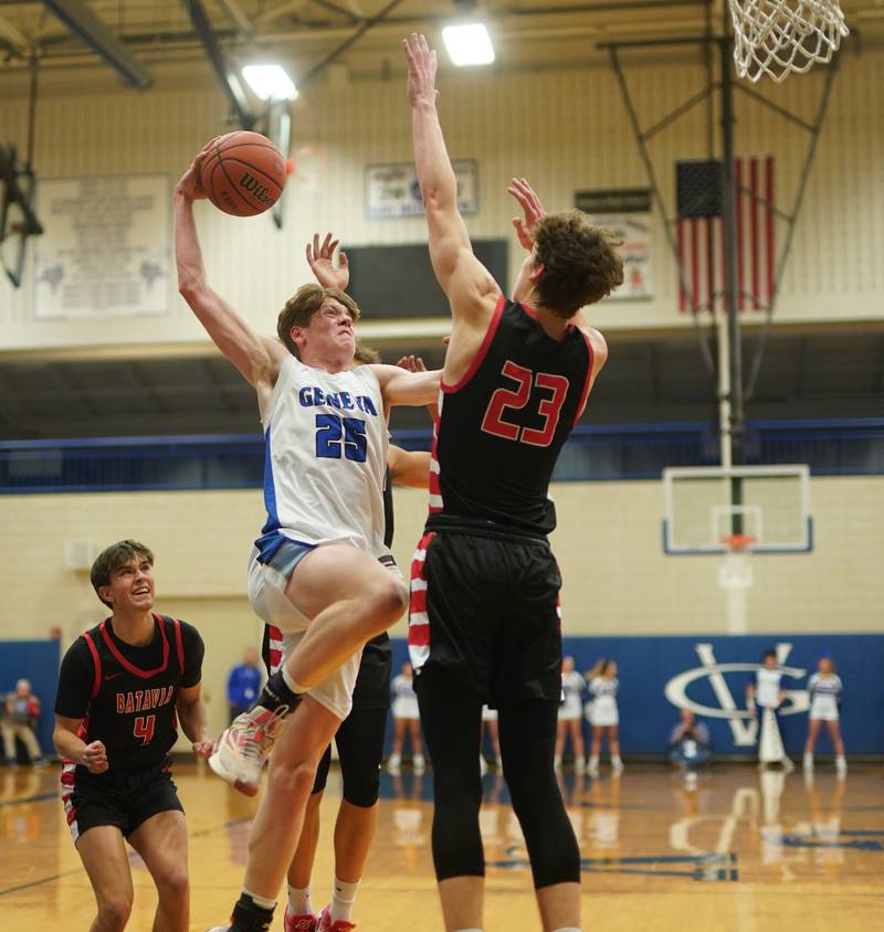 Geneva’s Hudson Kirby (25) drives to the hoop against Batavia’s Jax Abalos (23) during a basketball game at Geneva High School on Friday, Dec 15, 2023.