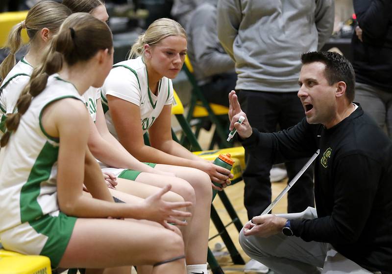 Crystal Lake South Head Coach Mark Mucha gives directions to his players during a timeout during a Fox Valley Conference basketball game against Jacobs on Friday, Jan. 17, 2025, at Crystal Lake South High School.