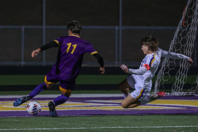 Cesar Casas of Mendota kicks ball past player of Aurora Central Catholic High School on Saturday, November 2, 2024 at Richard E. Phalen, SR. Field in Mendota.