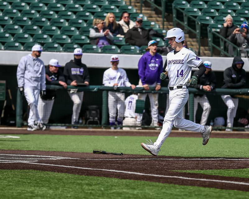 Hampshire's Danny Doherty (14) scores from third on a bases loaded walk during baseball game between Dixon at Hampshire.  March 28, 2024