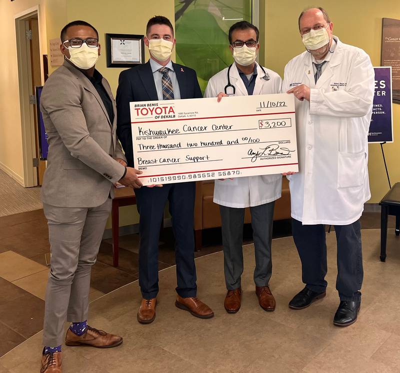 Brian Bemis Toyota of DeKalb staff members donating a check to Kishwaukee Cancer Center