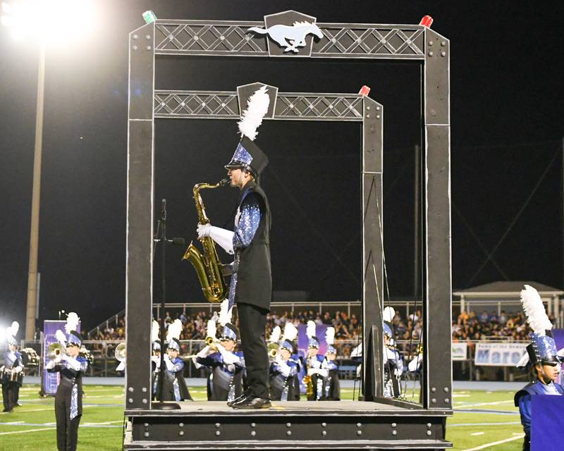Downers Grove South saxophone player Ellie Penavic preforms during the Downers Grove South Marching Music Mustangs on Saturday Oct. 5, 2024, held at Downers Gorve South football stadium.