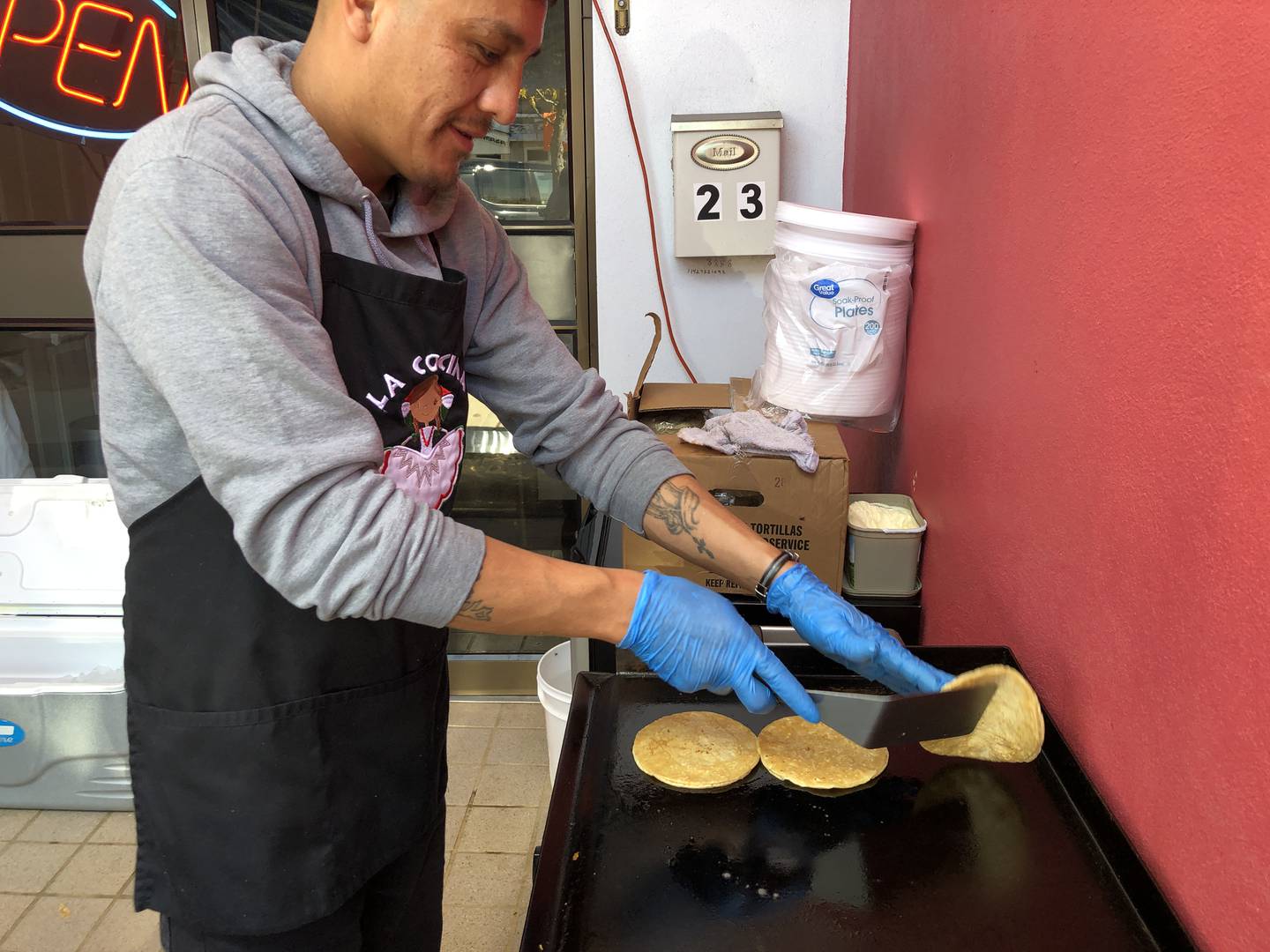 Leo Osorio preps tortillas for the tacos sold by Lo Cocina De Emma during Harvard's Day of the Dead festival on Saturday, Oct. 18, 2025.