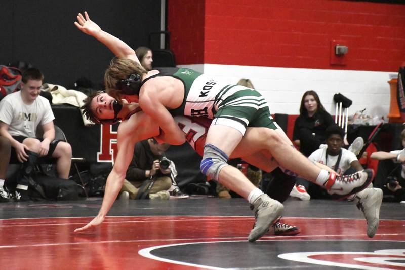 Bishop McNamara's Alex Kostecka takes down Bradley-Bourbonnais' Aidan Baud during the All-City wrestling meet on Wednesday, Dec. 3, 2025.