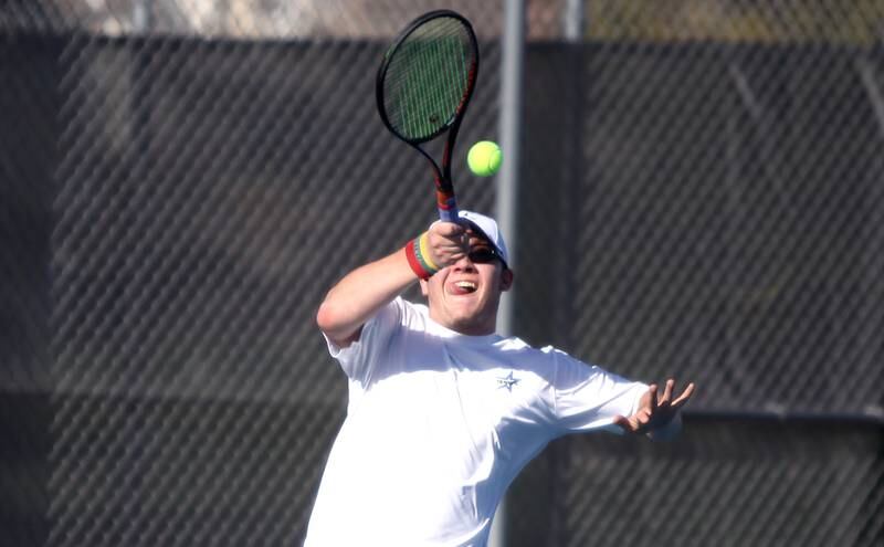 St. Charles North’s Mattas Ciabilis returns the ball during a number one singles match against Geneva’s John D’Andrea in St. Charles on Thursday, April 21, 2022.