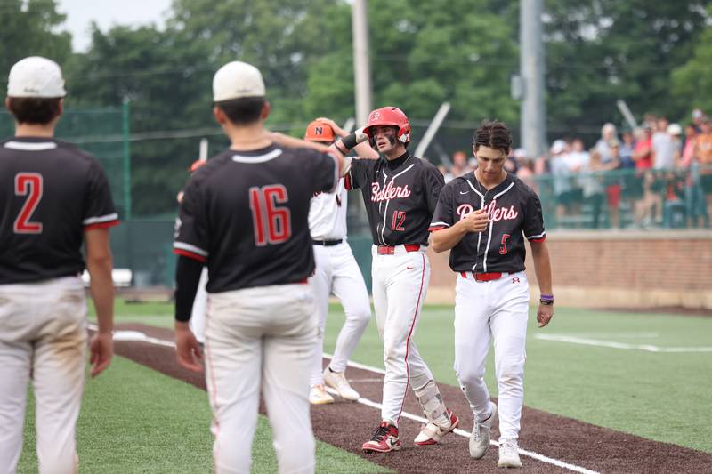 Bradley-Bourbonnais senior Cayden Arbour (12) and teammate Jace Boudreau (5) after theh final out during the Boilermakers' 2-0 loss to Normal Community in the IHSA Class 4A Illinois Wesleyan University Sectional semifinal on Thursday, June 5, 2025.