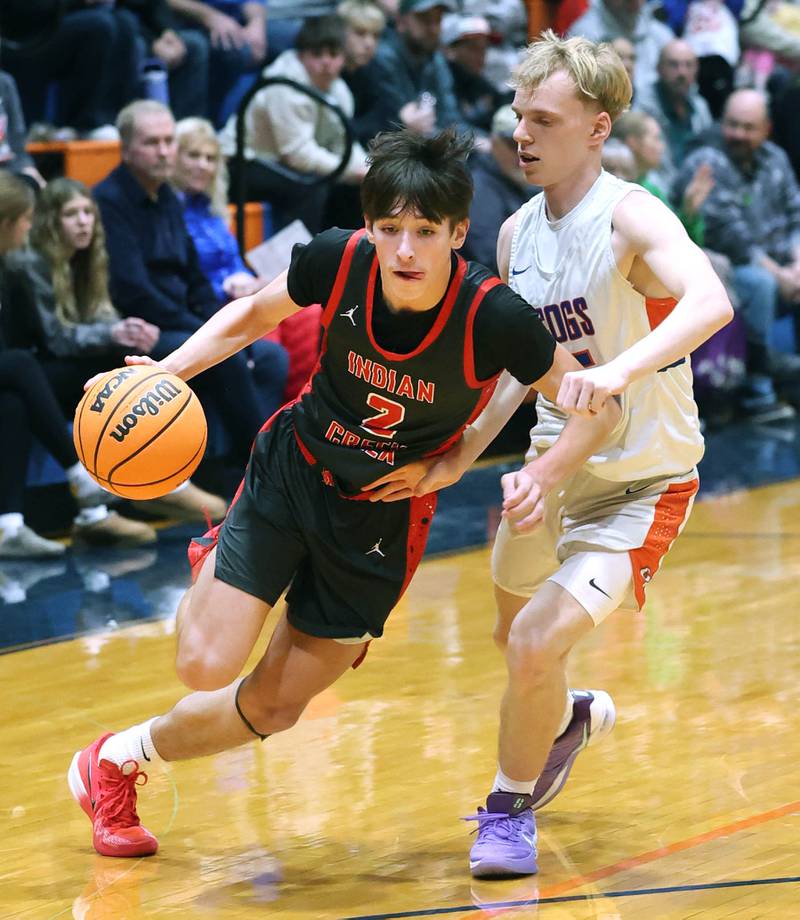 Indian Creek's Jason Brewer drives against Genoa-Kingston's Blake Ides during their game Friday, Jan. 2, 2026, at Genoa Kingston High School.