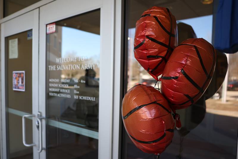 Basketball balloons decorate the front door at the Salvation Army Community Center. Friends and family host a reception for Joliet West’s basketball player Jeremy Fears Jr. before he heads to Houston to play in the All-McDonalds game.