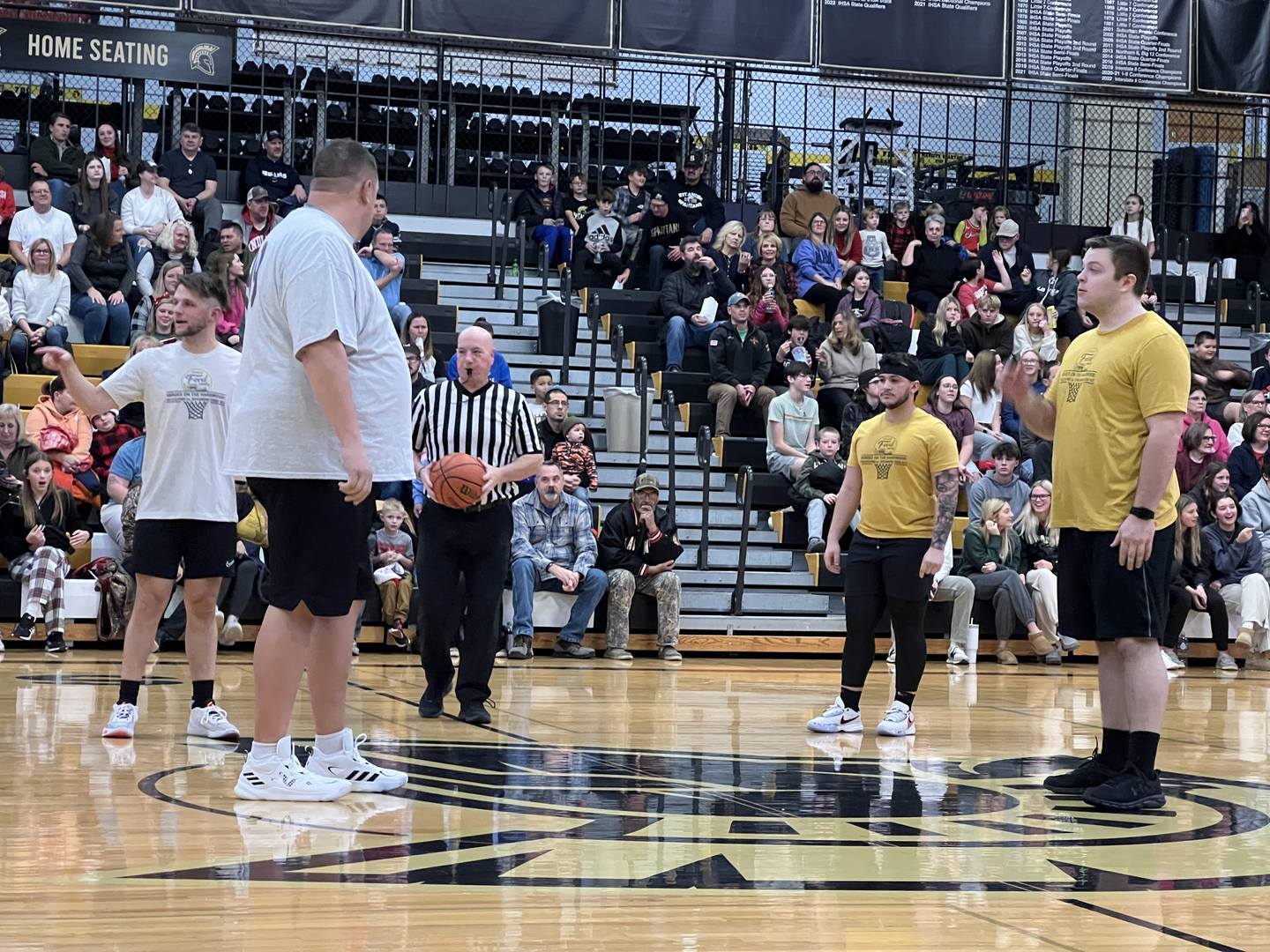 Players get set for the start of the first ever Heroes on Hardwood basketball game at Sycamore High School on Dec. 19, 2023.