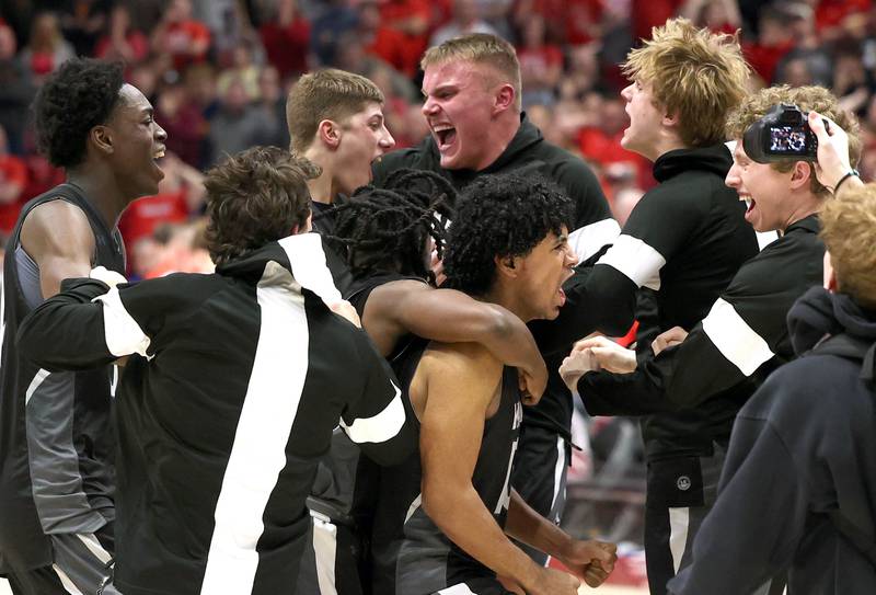 Kaneland players celebrate their win over Morton Monday, March 9, 2026, after their IHSA Class 3A supersectional matchup in the Convocation Center at Northern Illinois University in DeKalb.