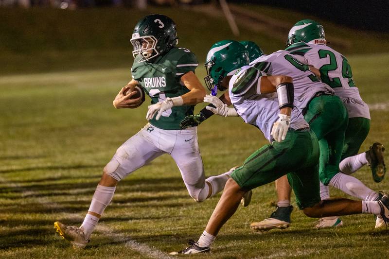 Stuart McGunnigal (3) of St. Bede is forced out of bounds whilst running ball by Leo Ovalle (6), Collin Mckibben (9) and Isiah Harris (24) of North Boone on Friday, Sept 12, 2025 at Captain Thomas J. Heitmann field in Peru.